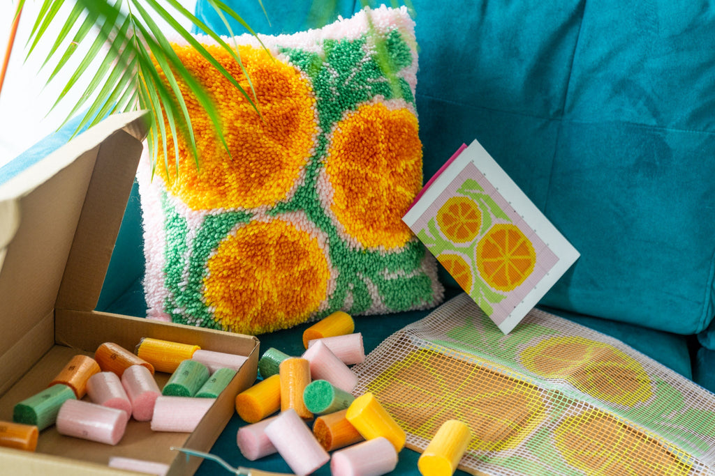 Photo of all latch hook cushions and rug making kits from The Crafts Collective